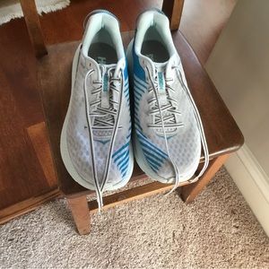 HOKA sneak white size 10 with teal color in areas seen in pictures.